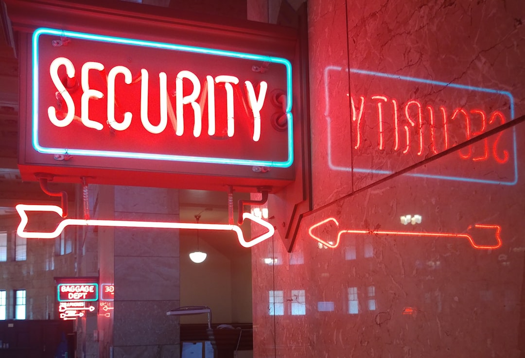 a-red-security-sign-and-a-blue-security-sign-ua8pwpht1vw